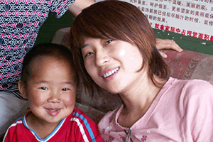 Kay Zhang with foster child